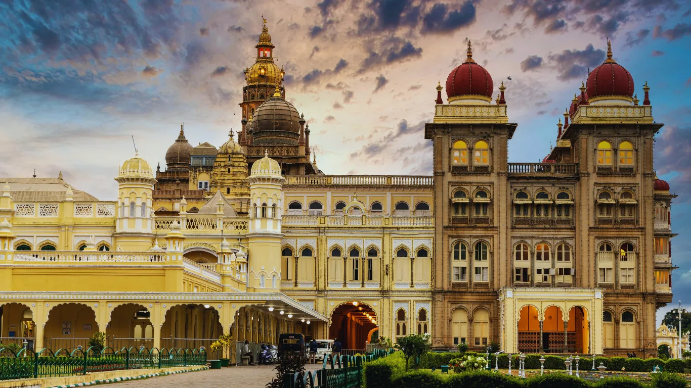 The brilliantly illuminated Mysore Palace at night, a royal highlight of the Kerala Karnataka Tour Package.